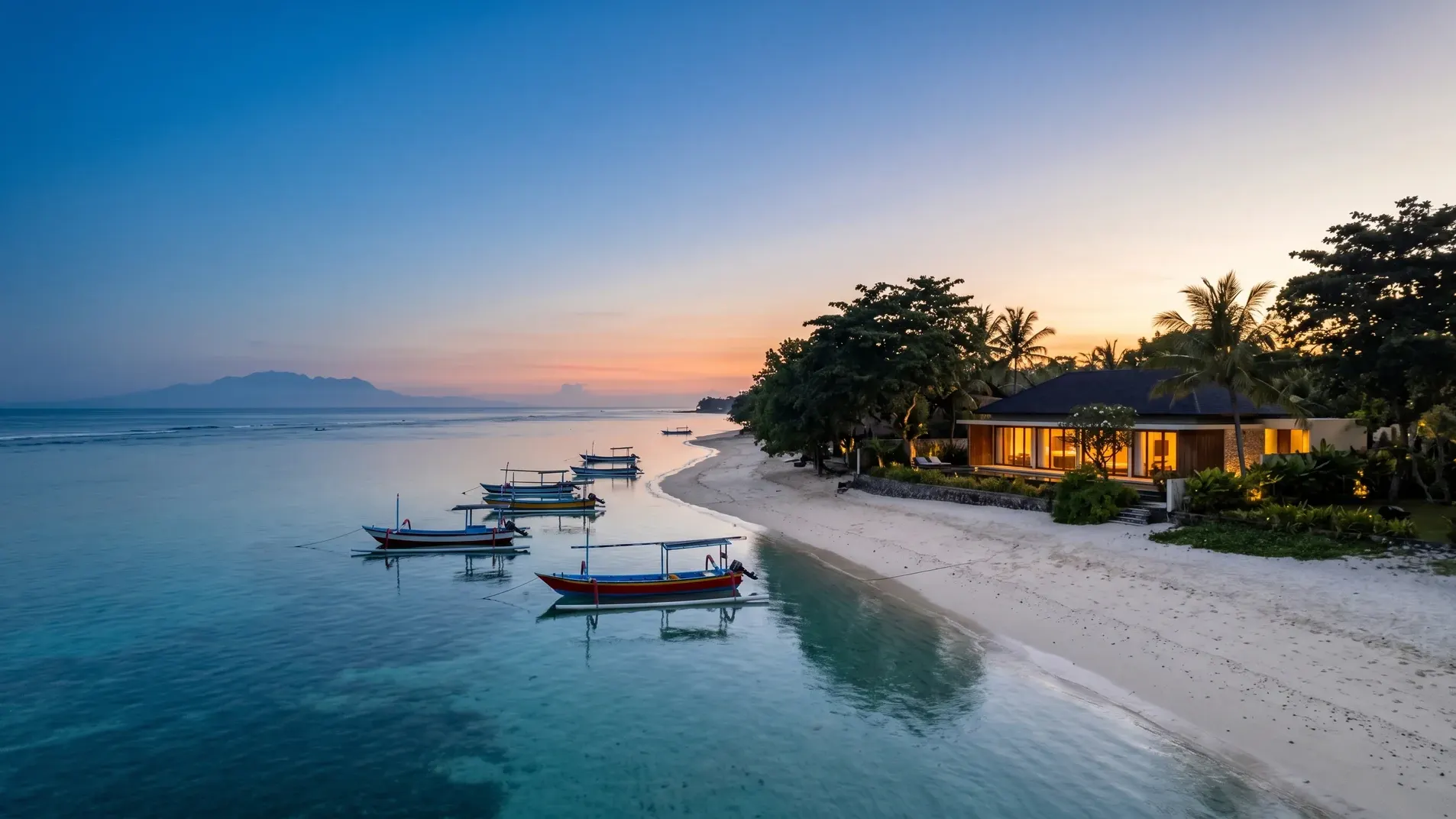 Editorial aerial of Sanur dawn — reef-protected calm water, anchored jukung outriggers, modernist villa at the foreshore